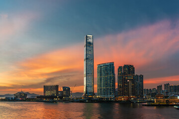 Fototapeta na wymiar skyscraper, skyline and harbor of Hong Kong city under sunset