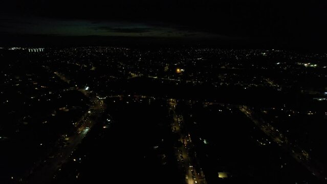 High Angle Footage of Central Luton City of England During Night. Illuminated City Centre Was Captured with Drone's Camera on July 9th 2023 During Mid Night