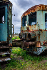 Fototapeta na wymiar Old rusty electric train abandoned on unused siding