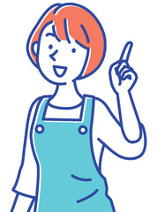 いいこと思いついたエプロン姿の若い保育士の女性