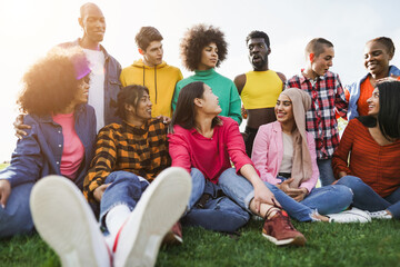 Young diverse people having fun outdoor laughing together - Soft focus on gay man face