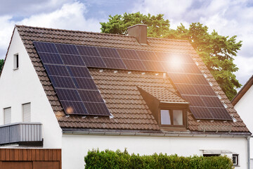 Solar Panel Roof House. Old Scandinavian Residential House with Brown Roof Tile and Solar Panels...