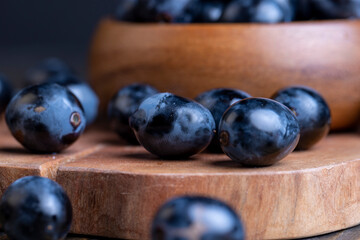 Unwashed blue grapes in the dust
