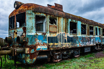 Fototapeta na wymiar Old rusty electric train abandoned on unused siding