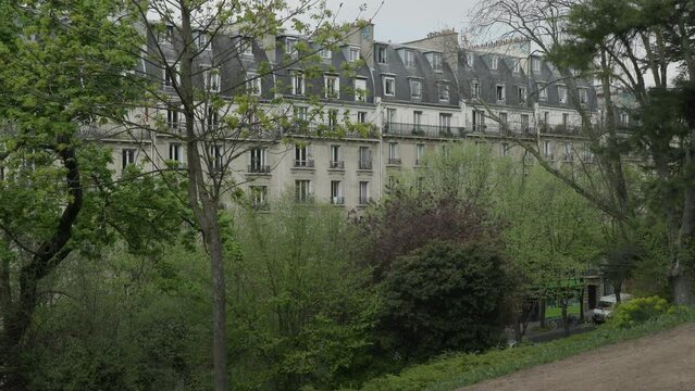 typical Paris apartment building next to park