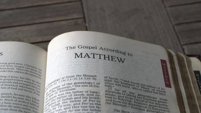 Close up and panning view on the book of Matthew of the bible.