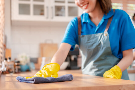 Housework or house keeping service female cleaning dust in home, cleaning agency small business. professional equipment cleaning old home.