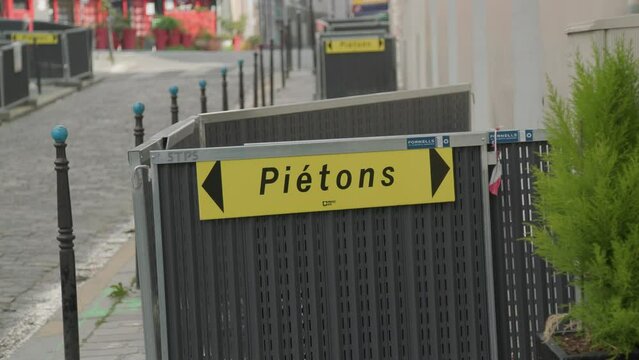 pedestrian sign at construction site in Paris