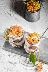 yogurt dessert with currants in a glass