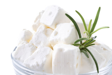 Feta cheese, cucumber and herbs in a bowl isolated on white background. Close up