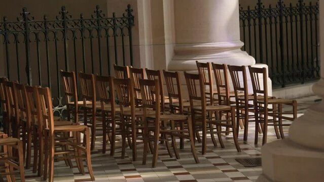 row of chairs in catholic church in Paris