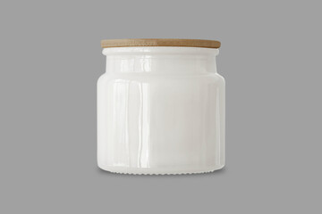 Blank White Candle glass jar with wooden lid. mockup template isolated on a grey background. Aromatic wax round spa candle. Realistic candlelight element design. 3d rendering.