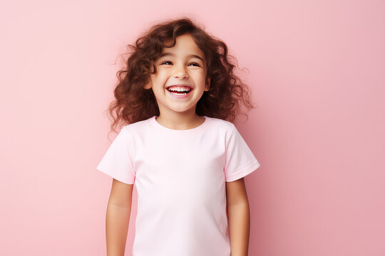Cute junior girl laughing and smiling with curly brown hair isolated on pink flat background with copy space. Happy little girl portrait. Generative AI studio photo imitation.