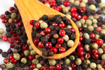 Pepper seasoning mix in wooden spoon