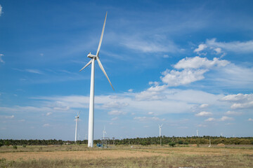 Fototapeta premium Wind Mill India.View of wind farm or wind park, with high wind turbines for generation electricity.Gomangalampudur, Pollachi, Tamil Nadu India