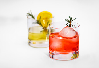 Two fresh cocktails with ice isolated in the studio