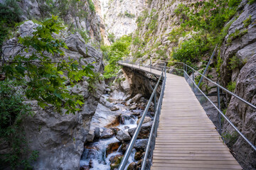 Fototapeta premium Sapadere canyon with wooden paths and cascades of waterfalls in the Taurus mountains near Alanya, Turkey