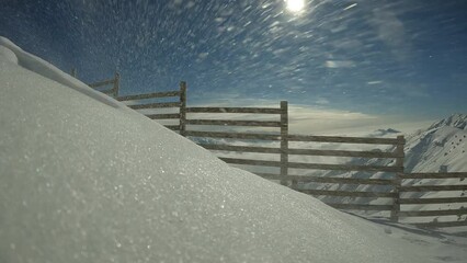 Wind Transport over snowdrifts, lighting shines with sun rays. On Throwing snow drifts on January day. Wind Transport straying into snowdrifts by the fence, frost and sun, wonderful day. blowing wind.