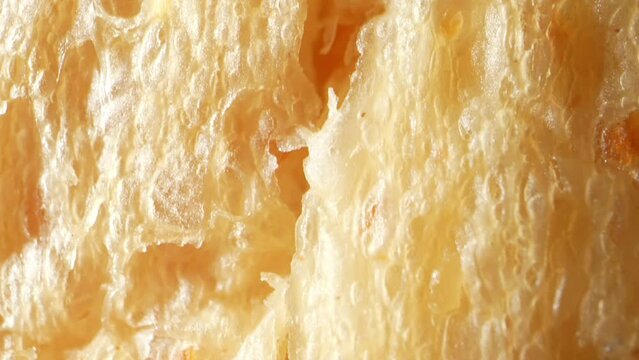 Indulge in the goodness of soft whole wheat bread, captured in stunning detail through a captivating macro video lens. Food concept. Bread background
