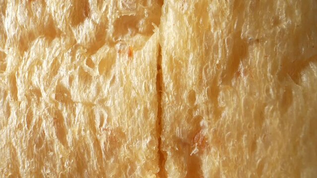 Heavenly Whole Wheat: Immerse yourself in the heavenly realm of softness with our whole wheat bread. A mesmerizing macro video, captured using a probe lens, reveals its intricate texture. 4K
