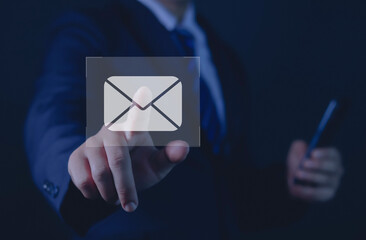 Businessman sending email from laptop computer, business technology concept	
