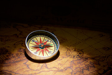 Fototapeta na wymiar Vintage compass on an old paper map