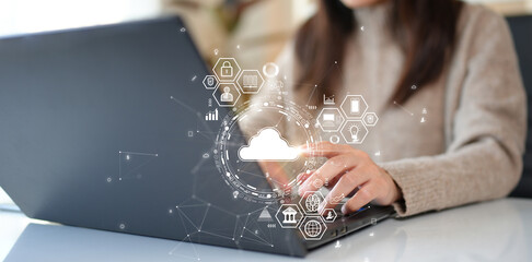 Women searching new storage alternative to computer storage using cloud or edge computing to back...