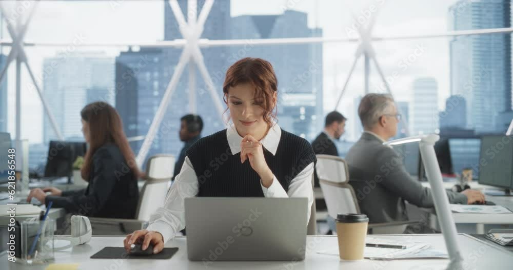 Poster beautiful caucasian woman working on laptop computer in bright office in urban skyscraper office in 