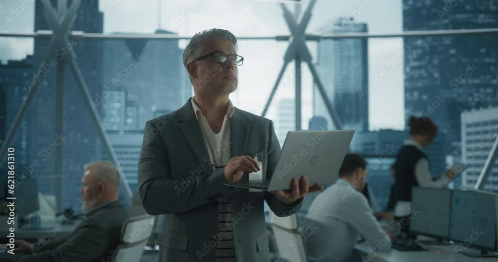 Poster succeful caucasian businessman walking in office with diverse employees in downtown skyscraper. midd