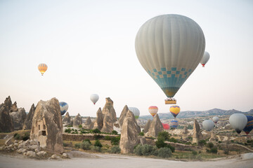 Fototapeta na wymiar beautiful scenery flight of balloons in the mountains of Cappadocia
