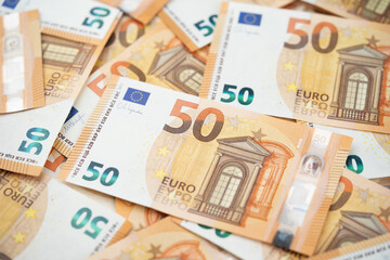 many 50 euro bills close-up mixed haphazardly