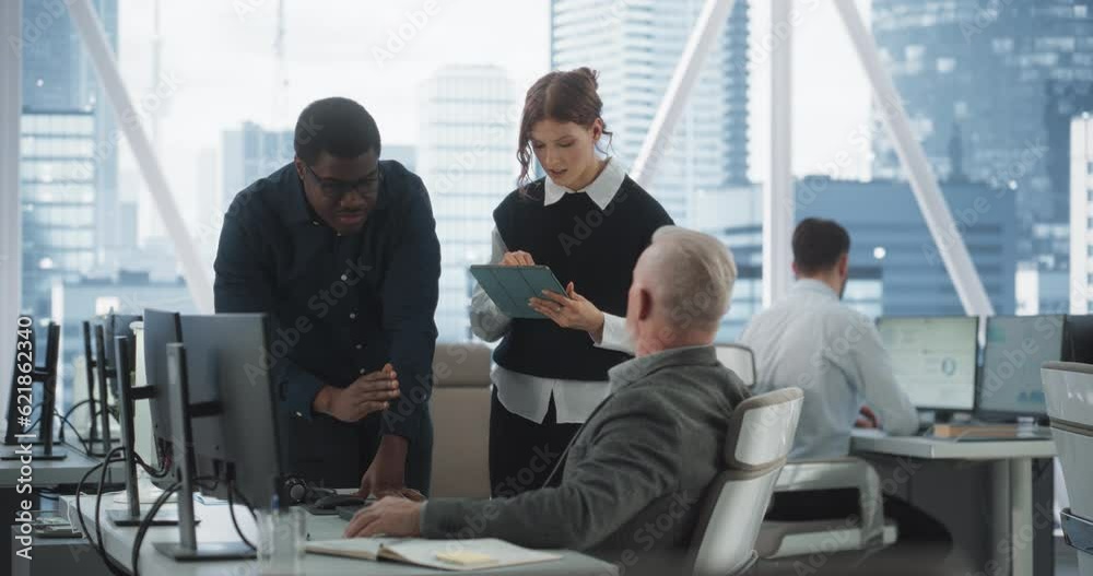 Poster Diverse Colleagues Talking In Front Of Desktop Computer In Corporate Office With Megapolis Window View. Caucasian Male Developer Showing New Code To African CEO And His Female Assistant With Tablet.
