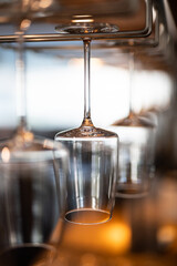 empty clean glass glasses for alcoholic drinks in a restaurant on a bar counter