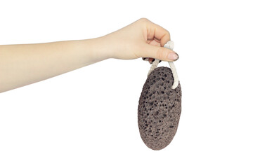 pumice stone, volcanic pumice stone for spa in hand isolated from background, concept to pass or...