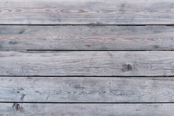 Old gray-brown wood background made of natural wood in grunge style. Top view.