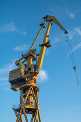 Shipyard crane against blue sky