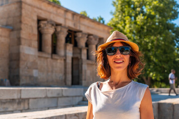 Temple of Debod in the city of Madrid of Egypt, young tourist woman with hat in the ancient...