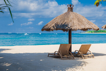 Chairs and umbrella at tropical beach with ocean. Holiday banner