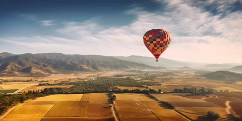 Fotobehang a hot air balloon over a valley © Pixel