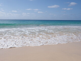 Fototapeta na wymiar Calm waves at beach on Sal island in Cape Verde