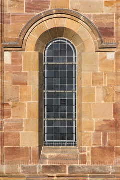 Romanesque round arch window at the Augustine monastery church in the old village of Pfaffen-Schwabenheim in Germany