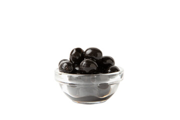 Tasty black olives isolated on white background. Olive and olive tree branches on a white table. Delicacy.