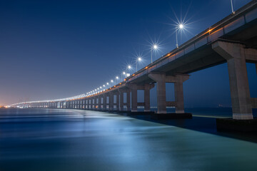 bridge and street lights over the sea
