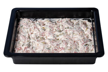 Italian salad isolated on white background. Salad prepared with peas, carrots, potatoes, salami, pickles and mayonnaise. healthy appetizers