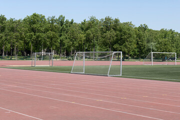 Empty goal for playing football on the of the stadium.