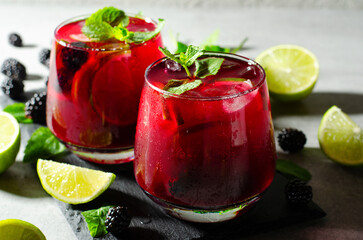 Berry Lemonade, Refreshing Drink, Cocktail, Iced Tea, Blackberry and Lime Summer Drink on Bright Background