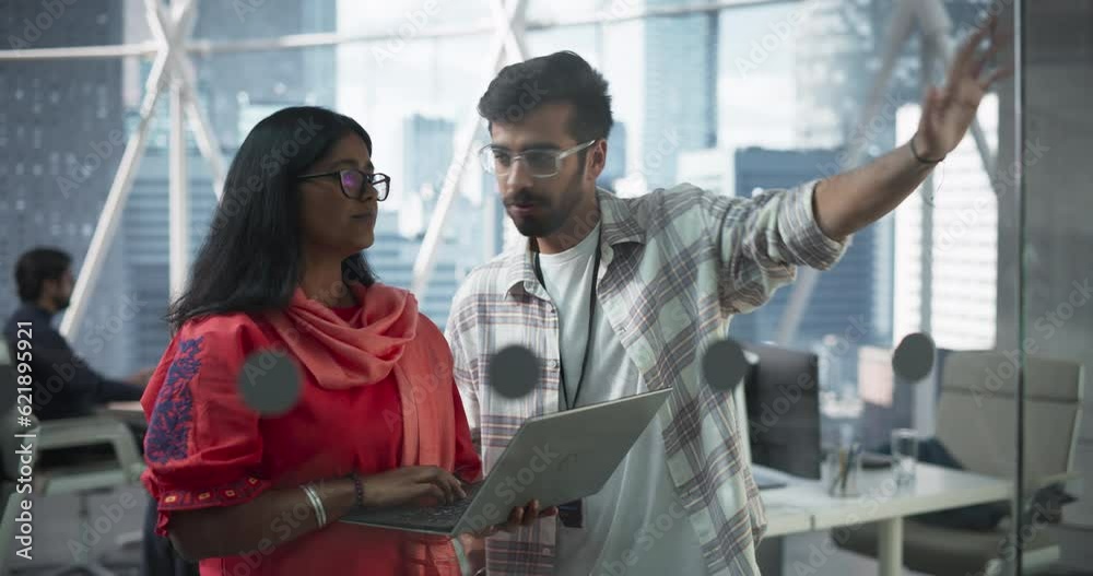 Poster Portrait of a Two Female and Male Engineers Using Laptop Computer to Analyze and Discuss How to Proceed with the Artificial Intelligence Software. Casually Chatting in High Tech Research Office