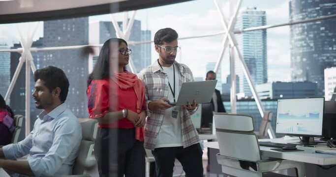Team of Talented Young Indian Professionals Working in a Business Research and Development Agency. Portrait of Two Specialists Talking About Emerging Markets for Investing and Partnerships