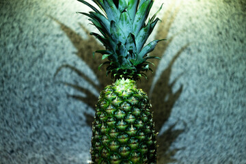 pineapple on a stone tabletop background and focus in the foreground