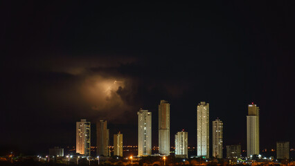 Fototapeta na wymiar Amazing Skyline of Skyscrapers during Thunderstorm Night